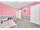 Bedroom boasts a large closet and window for ample natural light at 2791 Quarterland St, Strasburg, CO 80136