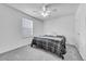 Bedroom featuring ceiling fan, window and modern color palette at 2791 Quarterland St, Strasburg, CO 80136