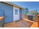 Back deck with grill, wood floors, and direct access to the house at 2791 Quarterland St, Strasburg, CO 80136