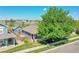 Charming single-Gathering home with a well-maintained lawn and mature tree providing shade at 2791 Quarterland St, Strasburg, CO 80136