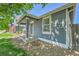 Charming home with covered porch with cozy seating area and well-maintained landscaping at 2791 Quarterland St, Strasburg, CO 80136