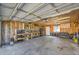 View of garage with workbench, tool storage and a door to the outside at 2791 Quarterland St, Strasburg, CO 80136