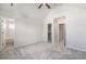 Bright bedroom features an en suite bathroom, a walk in closet, and plush carpet at 11873 W 51St Ave, Wheat Ridge, CO 80033