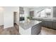 Modern kitchen with granite countertops, gray cabinets and stainless steel appliances at 11873 W 51St Ave, Wheat Ridge, CO 80033