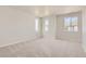 Spacious bedroom with neutral carpet, and multiple windows for great natural light at 14111 Deertrack Ln, Parker, CO 80134