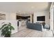 Open-concept kitchen and living area with modern island seating and stainless steel appliances at 14111 Deertrack Ln, Parker, CO 80134