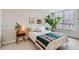 Inviting bedroom with a comfortable bed, side table, and natural light from the window at 1390 N Emerson St # 407, Denver, CO 80218