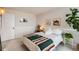 Cozy bedroom featuring warm lighting and plants, creating a serene and inviting space at 1390 N Emerson St # 407, Denver, CO 80218