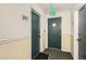 Hallway featuring a fire extinguisher, room numbers, and stairs to access other floors at 1390 N Emerson St # 407, Denver, CO 80218
