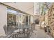 Cozy patio with stone walls, seating, a grill, and sliding glass doors that let in plenty of natural light at 1390 N Emerson St # 407, Denver, CO 80218