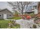 Spacious backyard featuring an outdoor patio, ample green space, and a large tree, creating a relaxing outdoor retreat at 1023 S High St, Denver, CO 80209