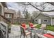 Charming backyard with patio seating, string lights, a lush lawn, and a detached garage, ideal for outdoor living and entertaining at 1023 S High St, Denver, CO 80209