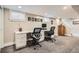 Finished basement area with built-in desk and cabinets, offering a functional workspace at 1023 S High St, Denver, CO 80209
