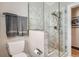 Bathroom boasts a tiled walk-in shower with seamless glass door and a towel rack at 1023 S High St, Denver, CO 80209
