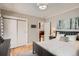 Inviting bedroom with a neutral color scheme, closet, and view into the kitchen at 1023 S High St, Denver, CO 80209