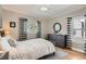 Comfortable bedroom with a calm color palette, large windows, and stylish curtains at 1023 S High St, Denver, CO 80209