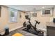 Bright exercise room with natural light, equipped with workout equipment and a sleek design perfect for a home gym setup at 1023 S High St, Denver, CO 80209