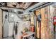 Utility area with a washer, dryer, and exposed utilities, great for practical home maintenance and laundry tasks at 1023 S High St, Denver, CO 80209