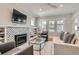 Bright living room with fireplace, built-in shelving, and plenty of natural light at 1023 S High St, Denver, CO 80209