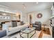 Open-concept living room featuring hardwood floors and a bright, airy atmosphere at 1023 S High St, Denver, CO 80209