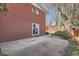 Backyard featuring a brick house and brick fence. Contains a patio area and some landscaping at 2201 S Holly St # 1, Denver, CO 80222