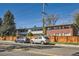 Two-story apartment building featuring assigned parking and street parking at 2201 S Holly St # 1, Denver, CO 80222