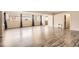 Bright living room with hardwood floors, large windows, and elegant curtains at 2201 S Holly St # 1, Denver, CO 80222