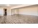 Spacious living area with hardwood floors, neutral tones, and open floor plan concept at 2201 S Holly St # 1, Denver, CO 80222