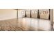 Bright living room featuring hardwood floors and large windows, perfect for natural light at 2201 S Holly St # 1, Denver, CO 80222