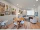 Cozy living room featuring modern decor, a dining area, and hardwood floors at 2721 W 167Th Pl, Broomfield, CO 80023