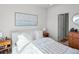Bright main bedroom with sleek white finishes, calming art, and bedside tables at 2721 W 167Th Pl, Broomfield, CO 80023