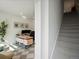 Bright home office with contemporary desk, staircase access, and modern decor at 2721 W 167Th Pl, Broomfield, CO 80023