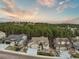 Beautiful aerial view of the home nestled among lush trees with a stunning mountain backdrop at 16113 Enchanted Peak Way, Monument, CO 80132