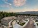 Scenic aerial view of the community with tree coverage and mountain views in the distance at 16113 Enchanted Peak Way, Monument, CO 80132