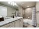 Bathroom featuring granite countertops, tile flooring, and shower-tub combination at 16113 Enchanted Peak Way, Monument, CO 80132