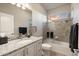 Bathroom featuring tub and shower combination, tile backsplash, granite vanity, and updated fixtures at 16113 Enchanted Peak Way, Monument, CO 80132