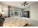 Spacious bedroom with a large window offering a serene view of the trees at 16113 Enchanted Peak Way, Monument, CO 80132
