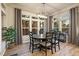 Stylish dining room with round table, modern lighting, and views of the outdoors at 16113 Enchanted Peak Way, Monument, CO 80132
