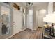 Bright foyer with a rug, hardwood floors, and ample natural light, showcasing a welcoming entrance at 16113 Enchanted Peak Way, Monument, CO 80132