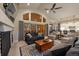 Beautiful living room with vaulted ceiling, fireplace and access to outdoor deck at 16113 Enchanted Peak Way, Monument, CO 80132