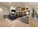 Spacious living room with fireplace and vaulted ceiling with large windows and outdoor access at 16113 Enchanted Peak Way, Monument, CO 80132