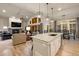 Open-concept space featuring a modern kitchen open to a living room with fireplace at 16113 Enchanted Peak Way, Monument, CO 80132