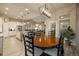 Open-concept kitchen and dining area, flowing seamlessly into the inviting living room at 16113 Enchanted Peak Way, Monument, CO 80132