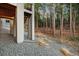 Covered patio with stone pillars overlooks the yard and woodland views at 16113 Enchanted Peak Way, Monument, CO 80132