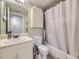 Clean bathroom with shower/tub combo and updated vanity at 3100 S Federal Blvd # 321, Denver, CO 80236