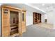 Home features a sauna and finished basement area with tile flooring and built in bookcase at 30041 Marys Dr, Conifer, CO 80433