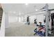 Spacious finished basement with workout equipment and plenty of room for activities at 30041 Marys Dr, Conifer, CO 80433