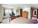 Bedroom features great natural light, a computer desk, and mountain views at 30041 Marys Dr, Conifer, CO 80433