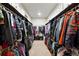 Walk-in closet with rods on both sides for plenty of storage at 30041 Marys Dr, Conifer, CO 80433