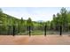 Wood deck with a beautiful mountain view, secured by a black metal railing at 30041 Marys Dr, Conifer, CO 80433